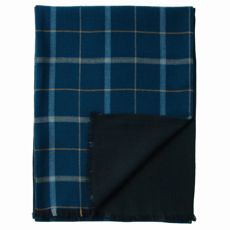 Double-sided dark navy wool scarf in a windowpane check. One side features a checked fabric, while the other side is solid navy blue