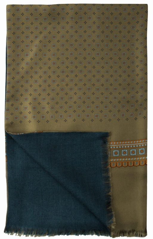 Elegant silk scarf in khaki with a blue and orange geometric pattern. Lined with a soft, navy wool backing and finished with decorative tassels