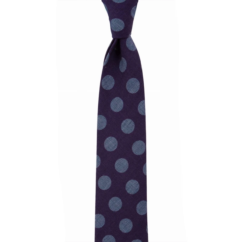 Purple tie with large blue polka dots