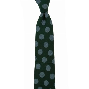 Dark green tie with large blue polka dots