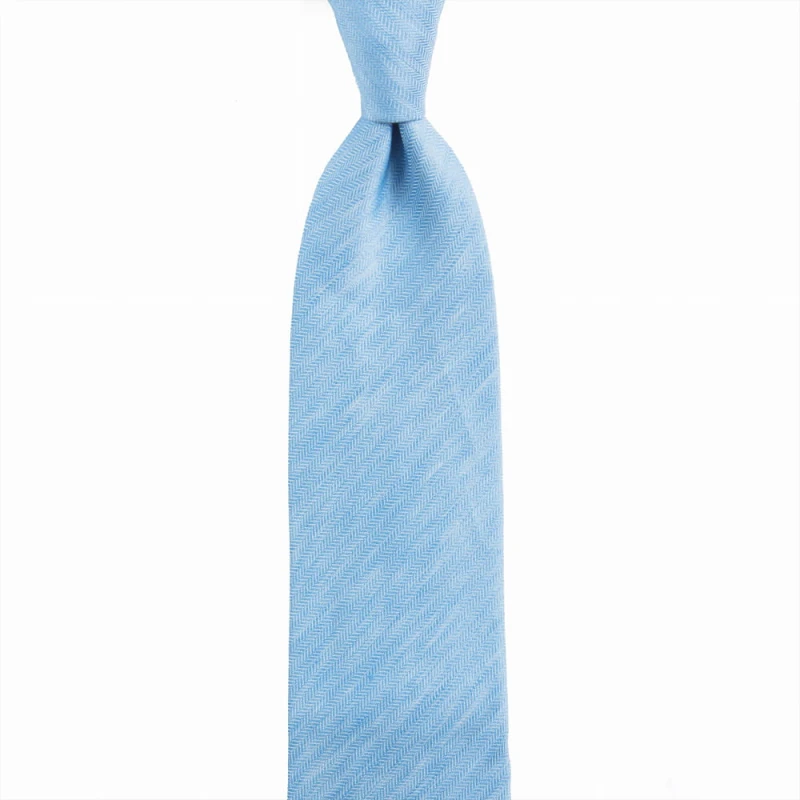 Blue tie with a herringbone pattern