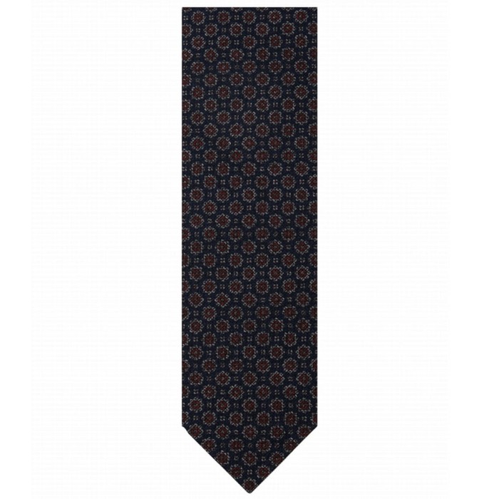 Silk tie made of printed grenadine with medallions pattern.