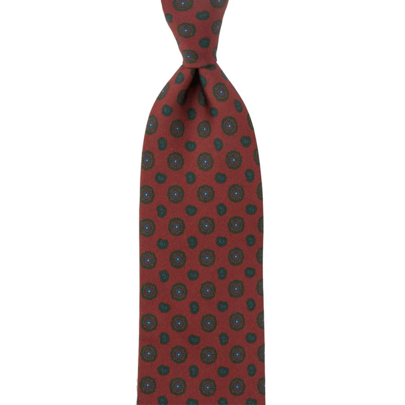 Brick coloured silk tie with green medallions