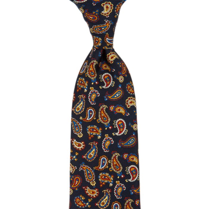 Dark navy silk tie with a golden paisley pattern