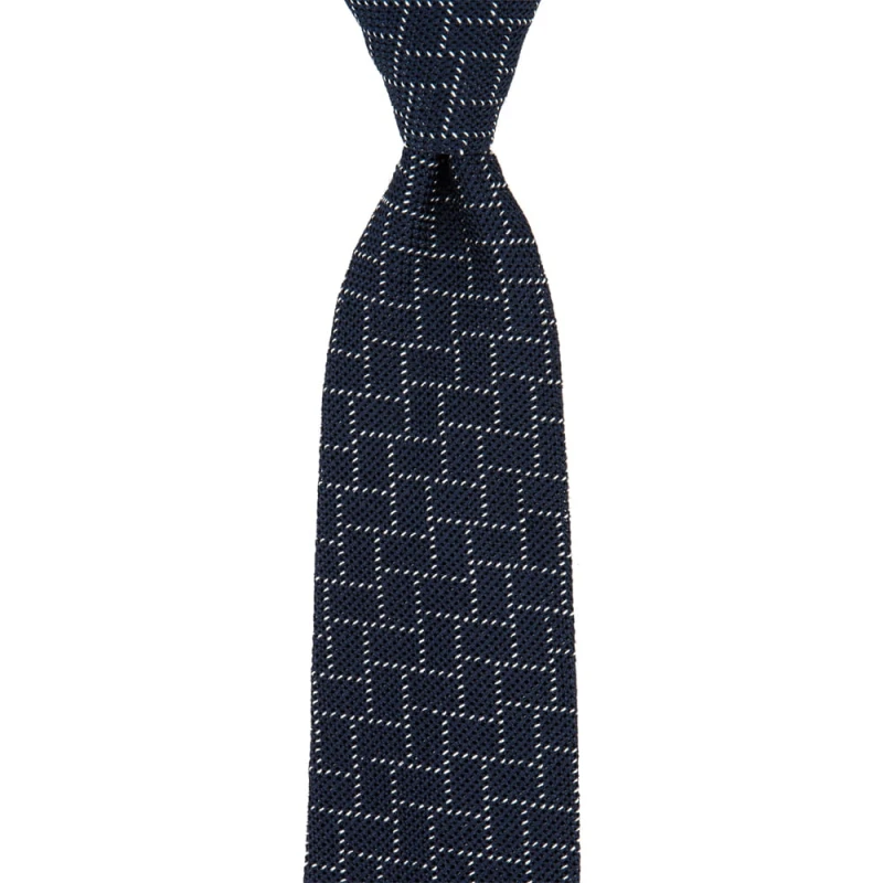 Navy blue tie with a grenadine in a white geometric pattern