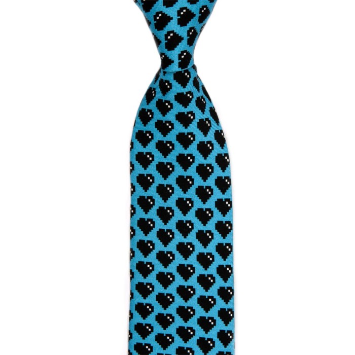 Light blue Moschino silk tie with black hearts pattern