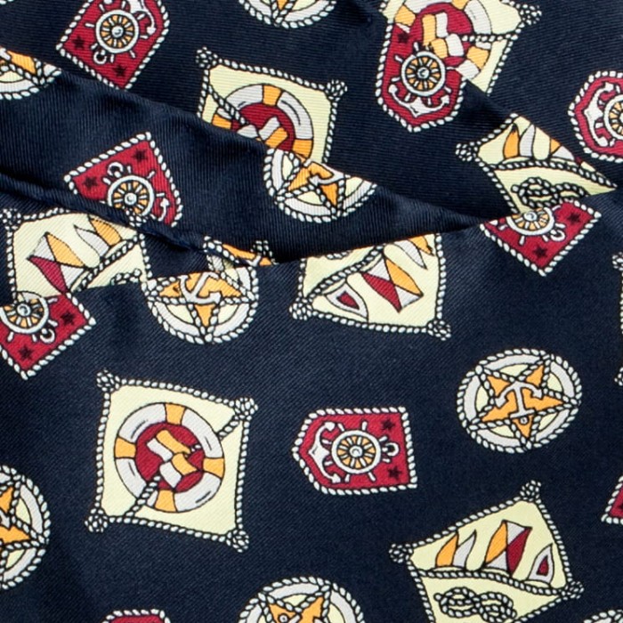 Navy blue silk pocket square with a maroon and yellow nautical pattern
