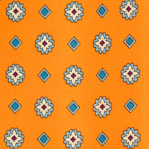 Orange silk pocket square with a white and blue floral pattern