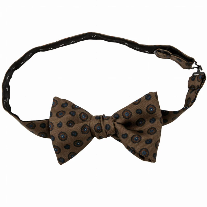 Brown silk bow tie with navy blue and orange medallions for self-tying