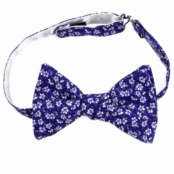 Purple cotton bow tie with white flowers