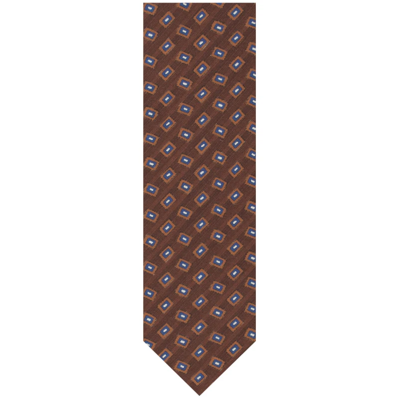 Brown silk tie featuring a geometric pattern in brown, navy, and white tones