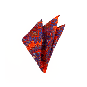 Silk pocket square with multicolour paisley pattern on orange ground, folded into a point