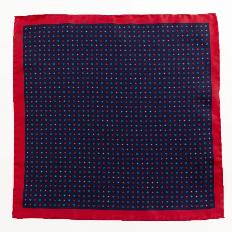 Navy silk pocket square with small flowers and red border, flat view