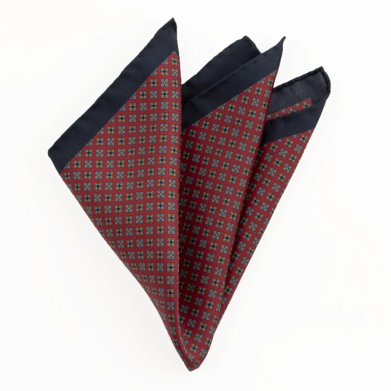 Printed silk pocket square with fine ornament - red and navy, folded into a point