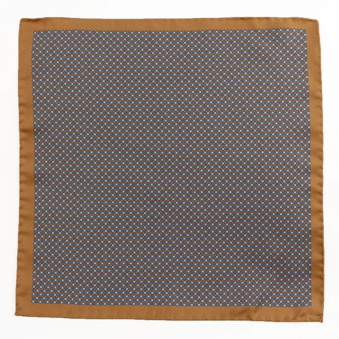 Light brown silk pocket square with a fine geometric pattern in blue, flat view