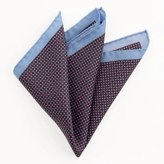 Printed silk pocket square with a fine geometric pattern - navy and blue, folded into a point