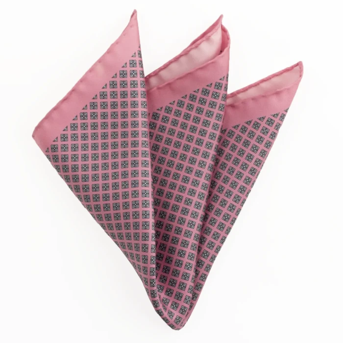 Printed silk pocket square with geometric rosettes - pink and navy, folded into a point
