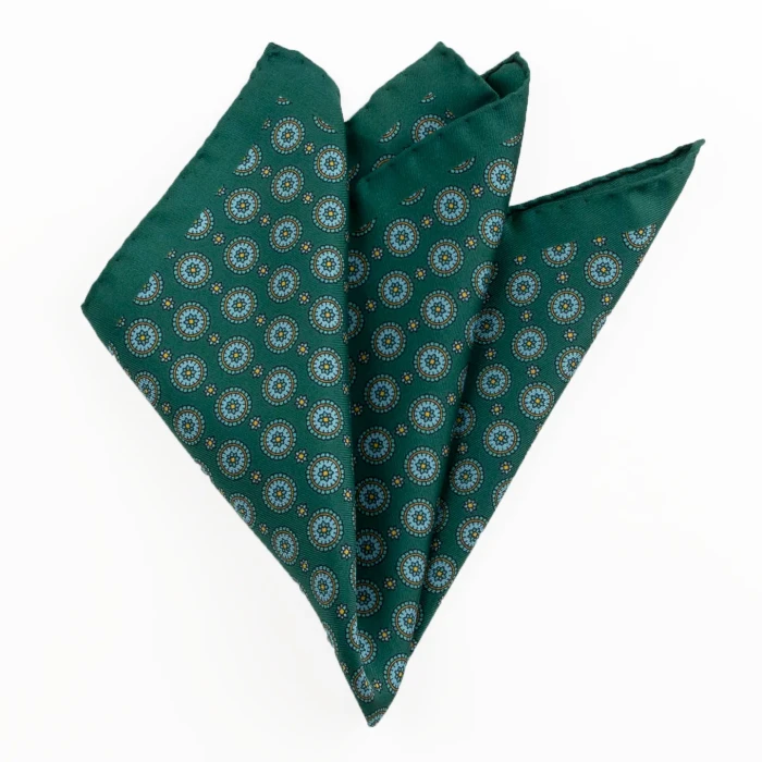 Printed silk pocket square with medallions - bottle green, light blue and gold, folded into a point