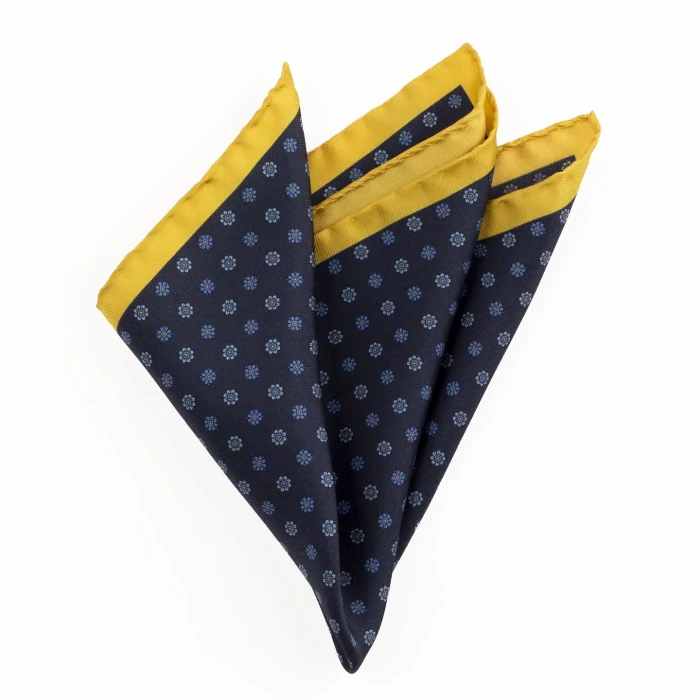 Printed silk pocket square with small flowers - navy and yellow, folded into a point