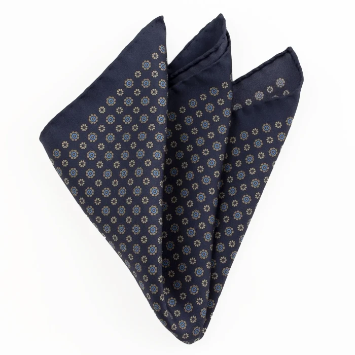 Printed silk pocket square with small rosettes - navy, blue and gold, folded into a point