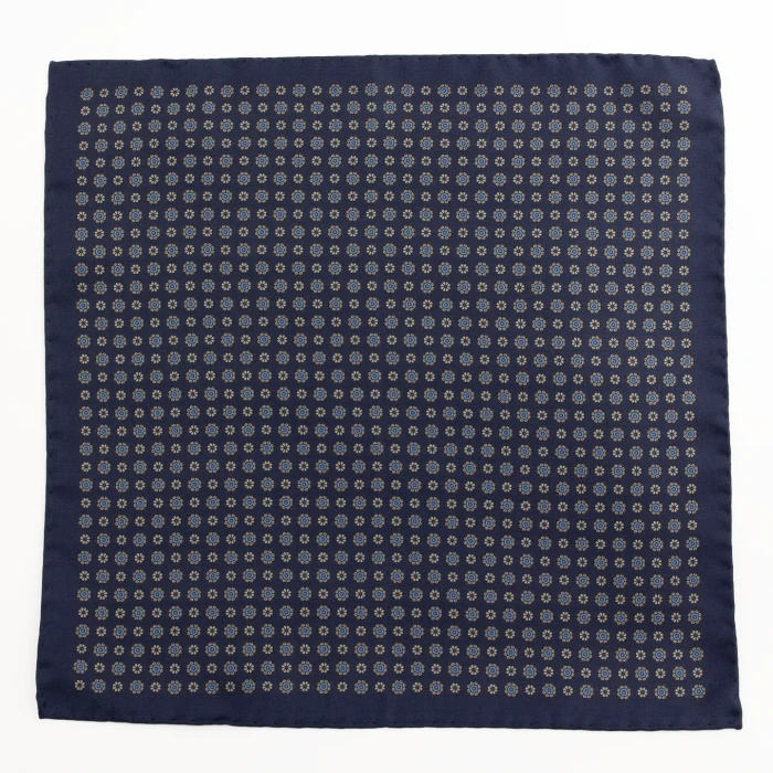 Navy silk pocket square with small rosettes in blue and gold, flat view