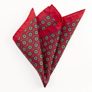 Printed silk pocket square with medallions - red, gold and navy, folded into a point