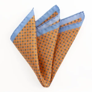 Printed silk pocket square with a fine geometric pattern - orange and blue, folded into a point
