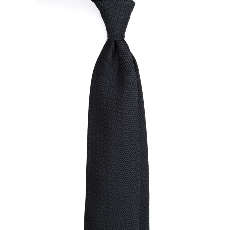A knotted graphite-coloured silk jacquard tie with a fine weave