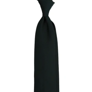 A dark green silk jacquard tie with a fine weave, tied in a knot