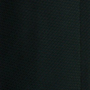 A close-up of a dark green silk jacquard tie with a fine weave