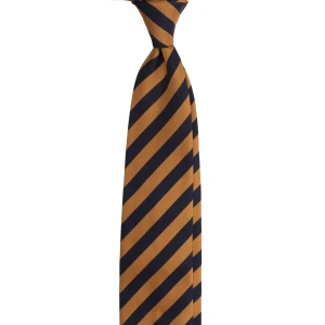 A navy silk jacquard tie in caramel stripes, tied in a knot
