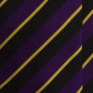 A close-up of a black and purple silk jacquard tie with gold pinstripes