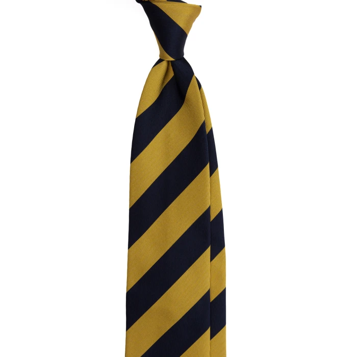 A navy silk jacquard tie in wide mustard stripes, tied in a knot