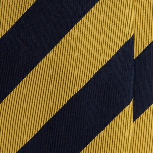 A close-up of a navy silk jacquard tie in wide mustard stripes