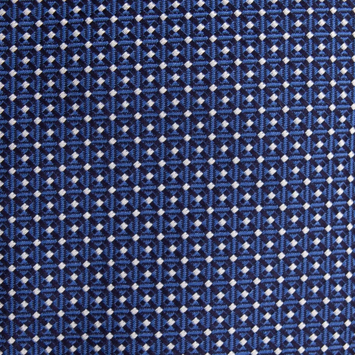 A close-up of a navy silk jacquard tie with a micro pattern