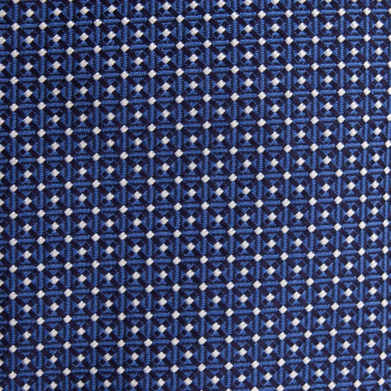 A close-up of a navy silk jacquard tie with a micro pattern