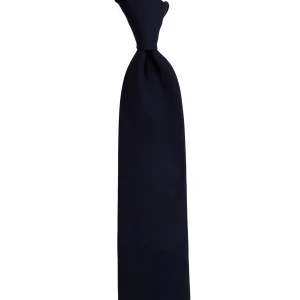 A plain navy silk tie, tied in a knot