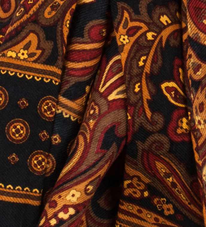 Dark navy wool scarf with a yellow-brown floral acanthus pattern - texture