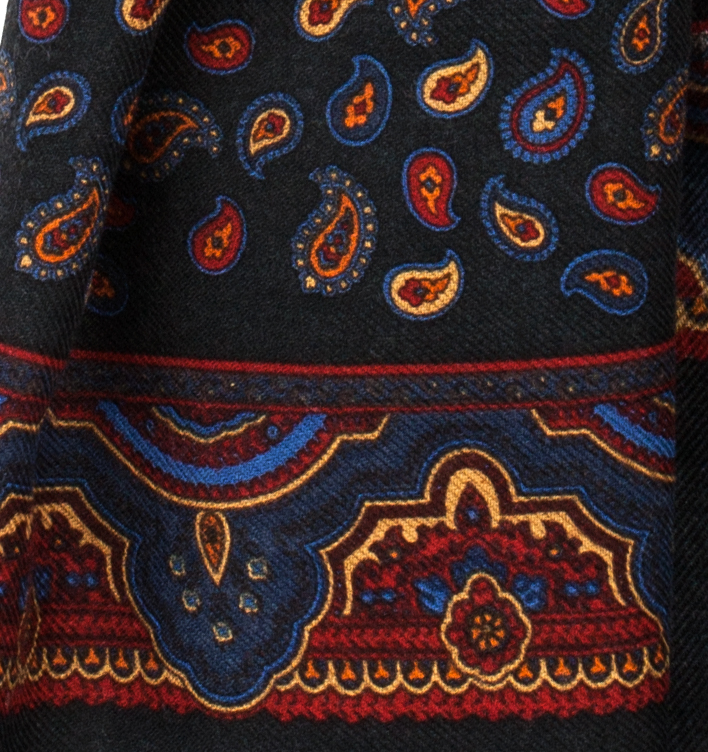 Elegant dark navy scarf with a delicate paisley pattern in burgundy, yellow, and blue tones - fabrics texture