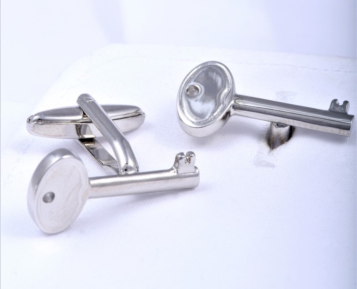 Cufflinks in the shape of a key