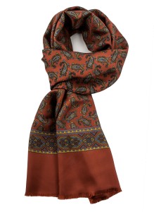 Rusty silk scarf in fine paisley in blue, yellow and green, finished with an ornamental stripe and fringes